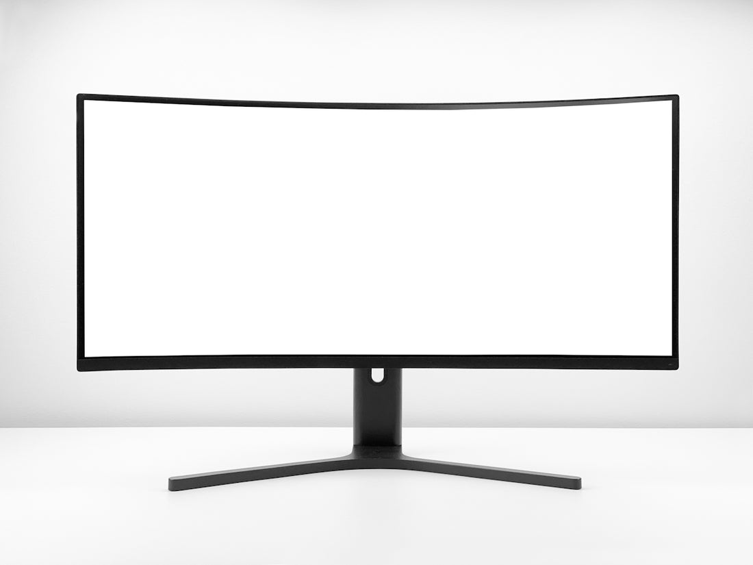 a white monitor with a black stand