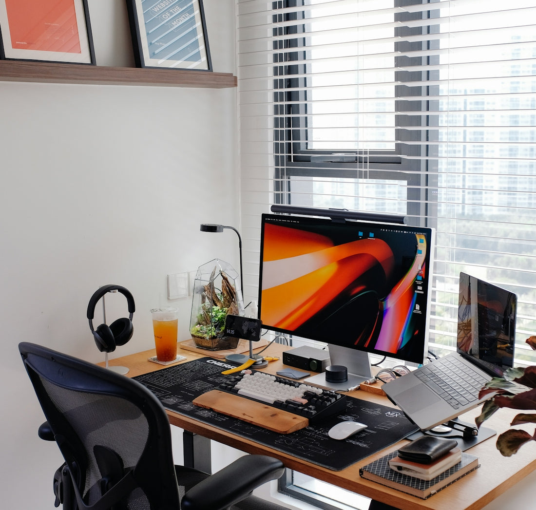 A home office workspace with many tech gadgets