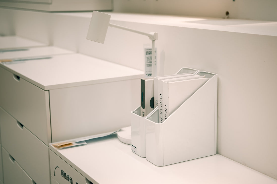 White office organizer with files on desk